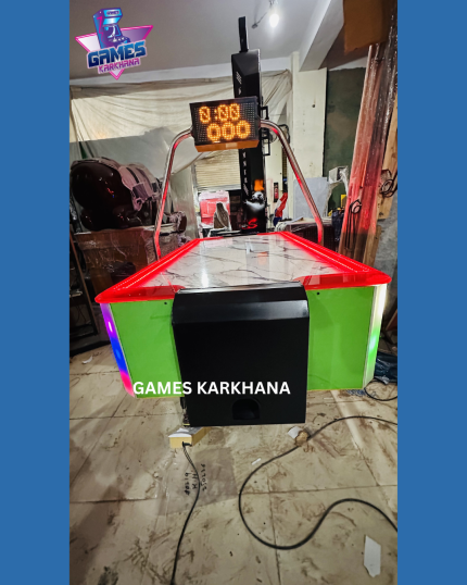 Coin operated air hockey table